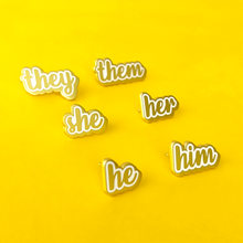 Load image into Gallery viewer, she/her, she/they, he/him, he/they, they/them matte gold and white enamel pronoun pins by proud zebra