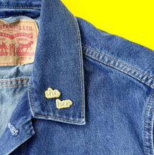 Load image into Gallery viewer, She/her matte gold and white pronoun pins on jean jacket by proud zebra