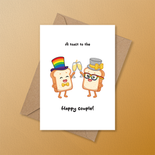 Load image into Gallery viewer, LGBTQ+ wedding card featuring two slices of toast dressed as a couple clinking champagne flutes, with the message "A toast to the happy couple!"

