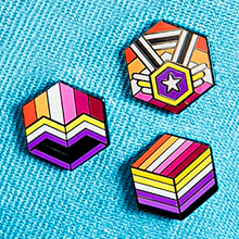 Load image into Gallery viewer, Three colorful geometric pins on a blue textured background
