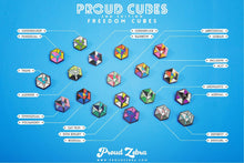 Load image into Gallery viewer, Inclusive rainbow pride flag Proud Cube 1.25-inch hard enamel pin Edition 2 with rubber clutch backing, held in hand for size reference
