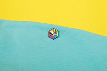 Load image into Gallery viewer, Inclusive rainbow pride flag Proud Cube 1.25-inch hard enamel pin Edition 2 with rubber clutch backing, styled on a denim jacket lapel
