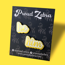 Load image into Gallery viewer, He/Him matte gold and white pronoun pins on black backing card by proud zebra
