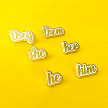 Load image into Gallery viewer, she/her, she/they, he/him, he/they, they/them matte gold and white enamel pronoun pins by proud zebra
