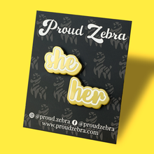 Load image into Gallery viewer, She/her matte gold and white pronoun pins on black backing card by proud zebra
